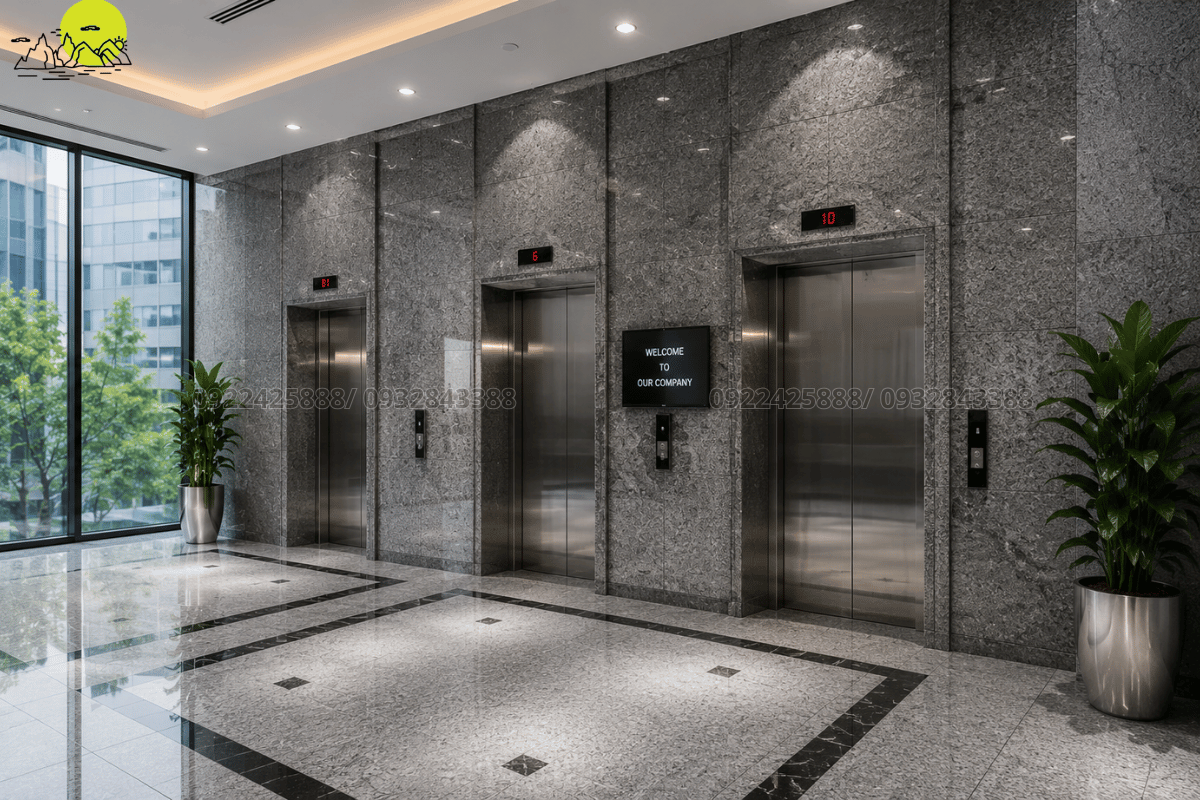 Không gian sảnh chờ thang máy văn phòng ốp đá granite xám